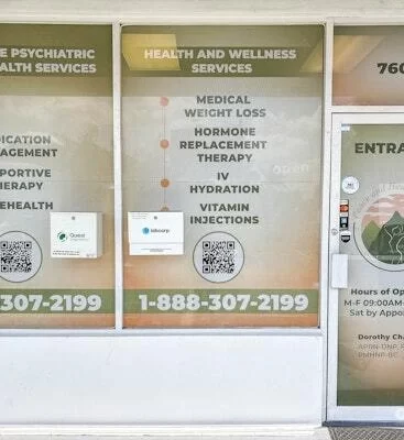 Clinic entrance signage with calming botanicals